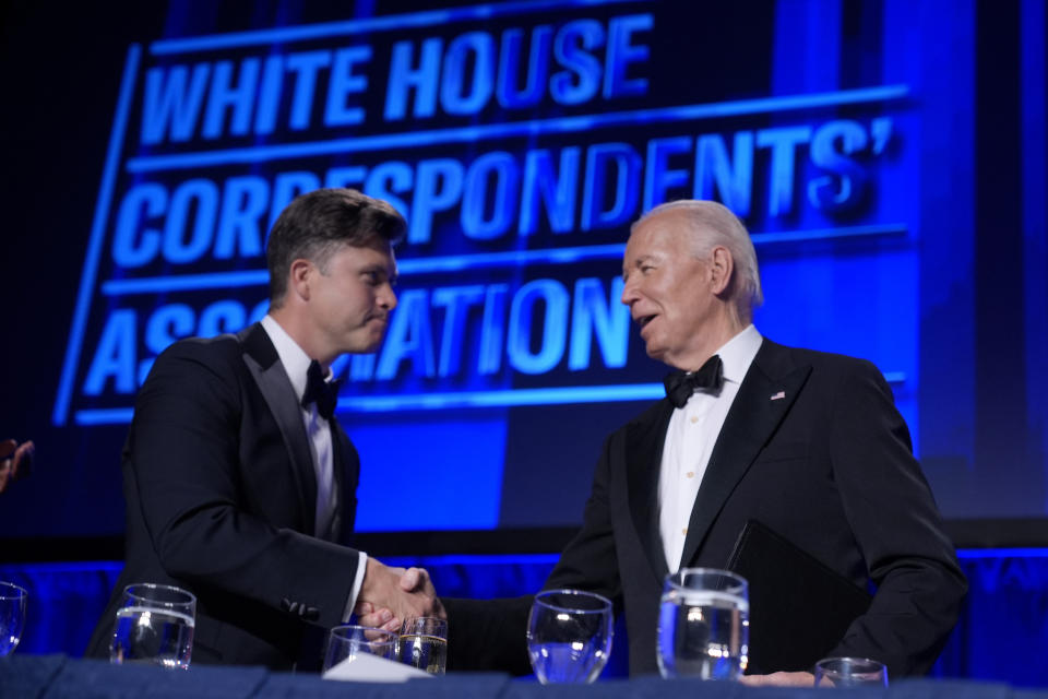 President Joe Biden, right, introduces host Colin Jost at the White House Correspondents' Association Dinner at the Washington Hilton, Saturday, April 27, 2024, in Washington. (AP Photo/Manuel Balce Ceneta)