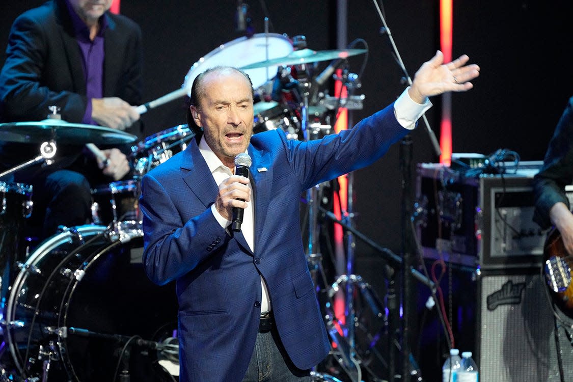 Lee Greenwood performs with Sixwire on the second day of the Republican National Convention at the Fiserv Forum.