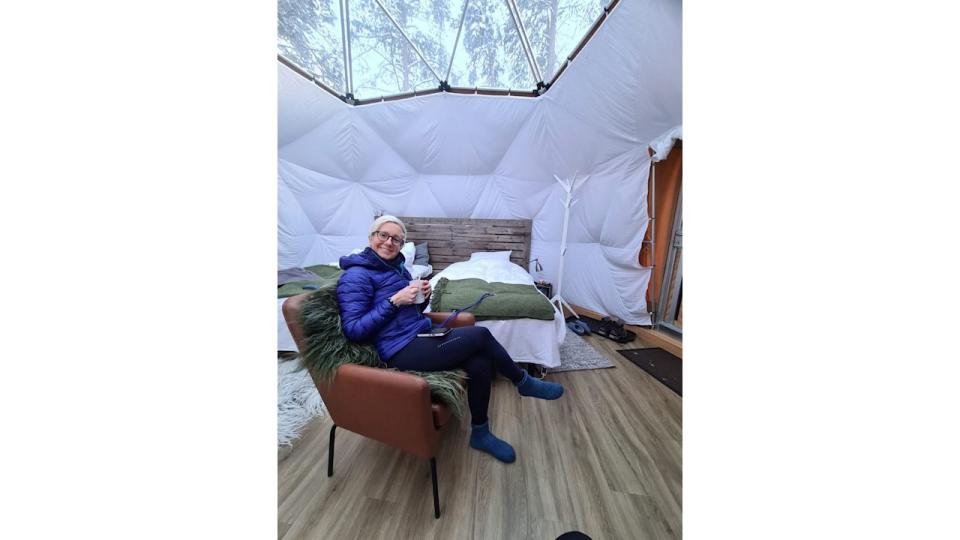 Woman sitting in a tent in the arctic circle