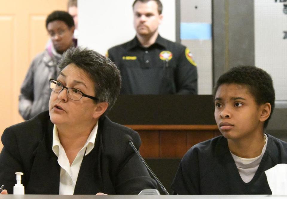 FILE - Chrystul Kizer, right, and her attorney Larisa Benitez-Morgan sit together in the Kenosha County Courthouse on Feb. 6, 2020. Wisconsin's Supreme Court is set to decide Wednesday, July 6, 2022, whether Kizer, an alleged sex trafficking victim accused of homicide, can argue at trial that she was justified in killing the man who trafficked her, a ruling that could help define the extent of immunity for trafficking victims nationwide. (Paul Williams/The Kenosha News via AP, File)