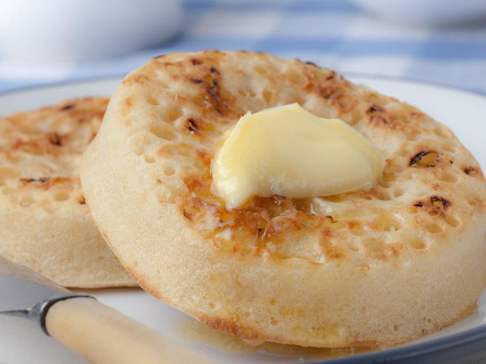 buttered crumpets on a plate