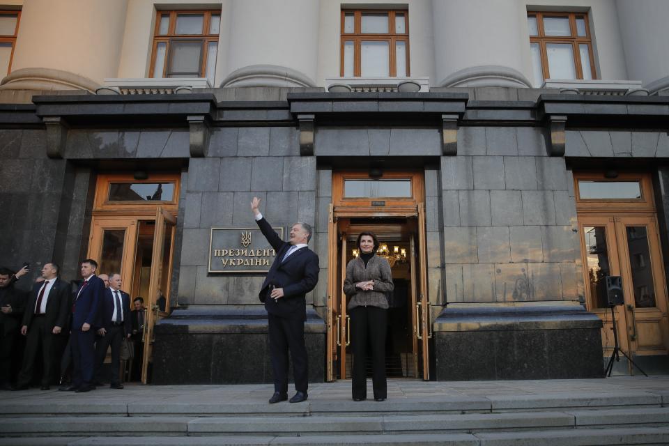 Ukrainian President Petro Poroshenko and his wife Maryna great their supporters who have come to thank him for what he did as a president, at the presidential administrations building in Kiev, Ukraine, Monday, April 22, 2019. Political mandates don't get much more powerful than the one Ukrainian voters gave comedian Volodymyr Zelenskiy, who as president-elect faces daunting challenges along with an overwhelming directive to produce change. (AP Photo/Vadim Ghirda)