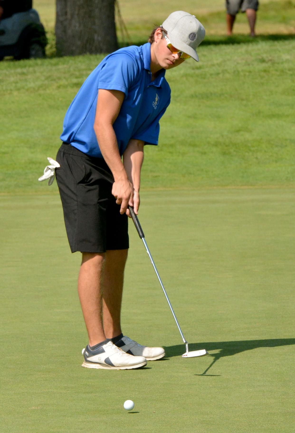 Aberdeen Central's Peyton Brust sinks a long eagle putt on No. 5 Tuesday during the Watertown Invitational boys golf tournament at Cattail Crossing Golf Course. Public Opinion by Roger Merriam