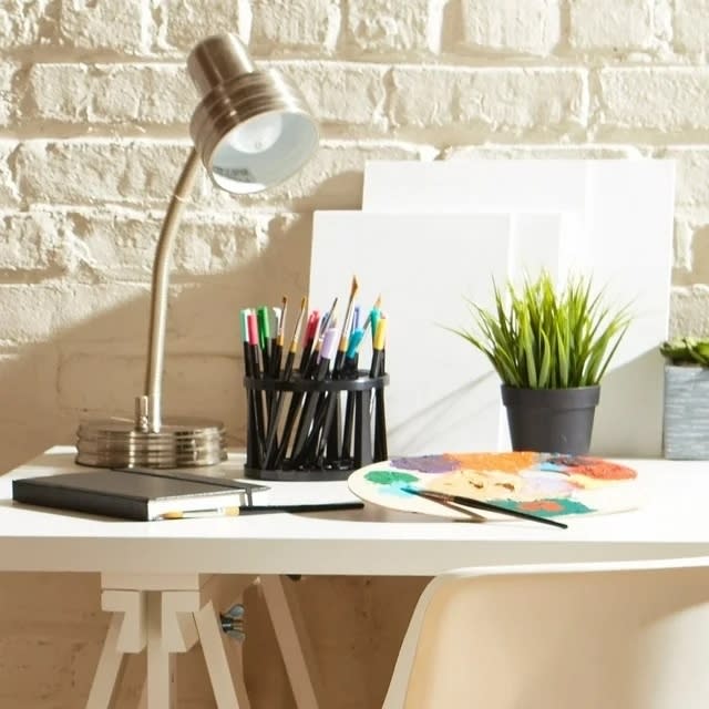 organizer on desk holding various art tools