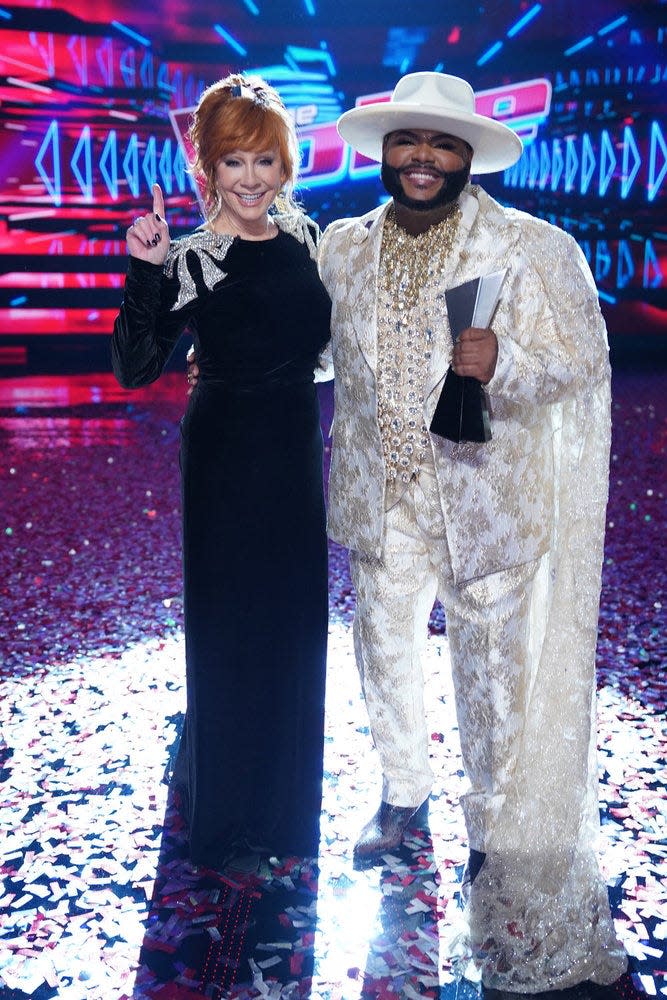 "The Voice" Season 25 winner Asher HaVon, right, and his coach, Reba McEntire, are seen on May 21 in a victory photo on the live season finale.