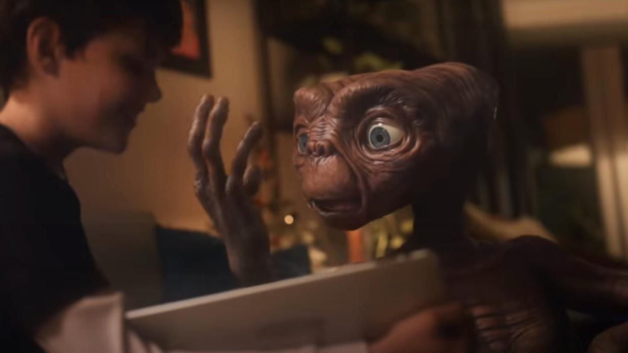  ET marvels over a tablet in the 2019 Xfinity Christmas Ad. 