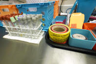 Evidence collection tubes, sealing tape and evidence collection envelopes are pictured on an autopsy bay in the Mississippi Crime Laboratory in Pearl, Miss., Aug. 26, 2021. (AP Photo/Rogelio V. Solis)