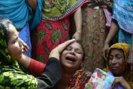 A Bangladeshi relative of a victim of the Rana Plaza building collapse weeps as she takes part in a protest marking the first anniversary of the disaster at the site where the building once stood in Savar, on the outskirts of Dhaka, on April 24, 2014