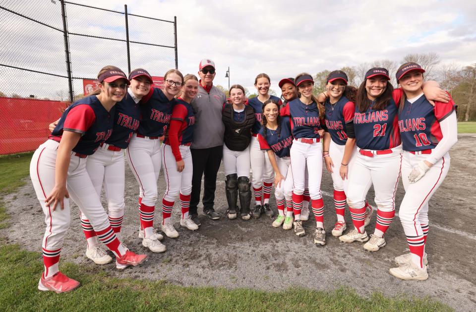 Bridgewater-Raynham head coach Mike Carrozza celebrates with players after he won his 400th career game versus Brockton on Wednesday, May 3, 2023. 
