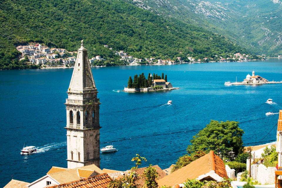 kotor bay in montenegro, the village of perast and the bell tower of the church of saint nicholas the two islands are saint george and our lady of the rocks with the roman catholic church of the same name