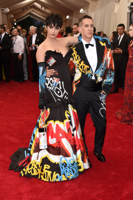 <p>Katy Perry in Moschino.</p><p>Katy Perry, with her date and dress designer Jeremy Scott, is wearing a gown straight off his recent runway show. She completed the graffiti look wearing her “Kris Jenner” wig.</p>