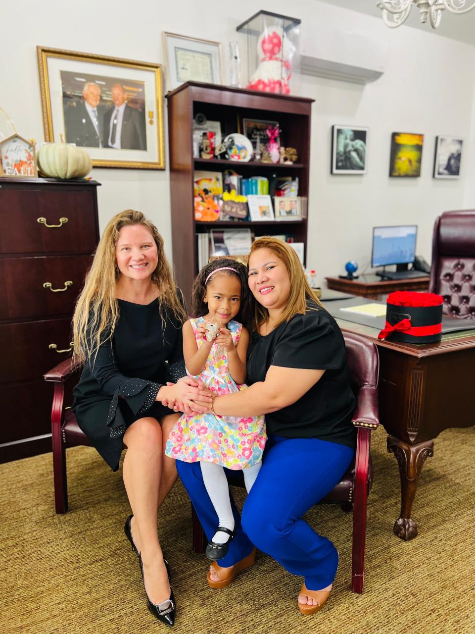 Attorney Gintare Grigaite, left, four-year-old Caroline Andra Arroyo Polanco, and her mother, Betsaida Dilenia Polanco Polonia at Gritaite’s law offices