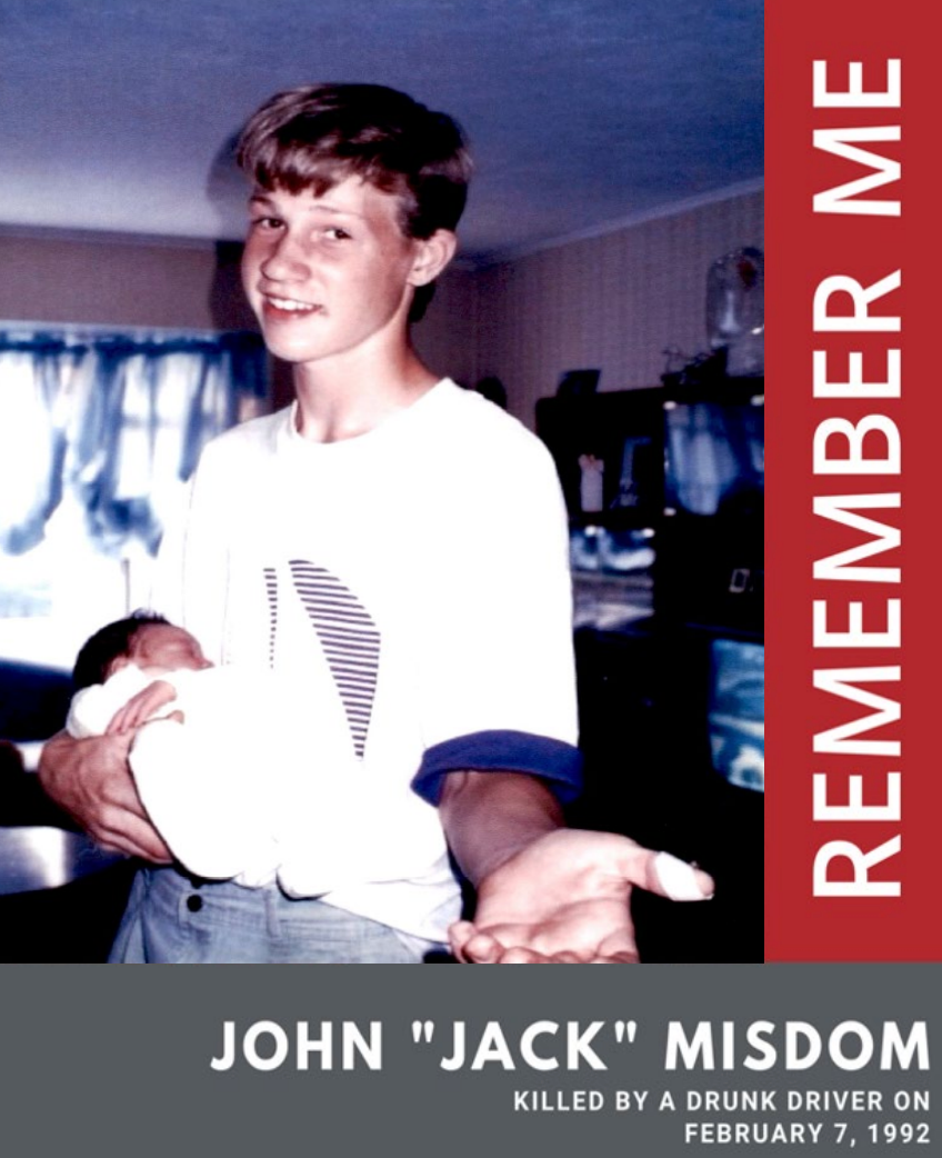 John R. "Jack" Misdom Jr., was killed by a drunk driver in February 1992 at the age of 16 as he was walking along the shoulder of Route 36 in Middletown. He's shown holding a newborn cousin. This poster is used at DWI checkpoints.