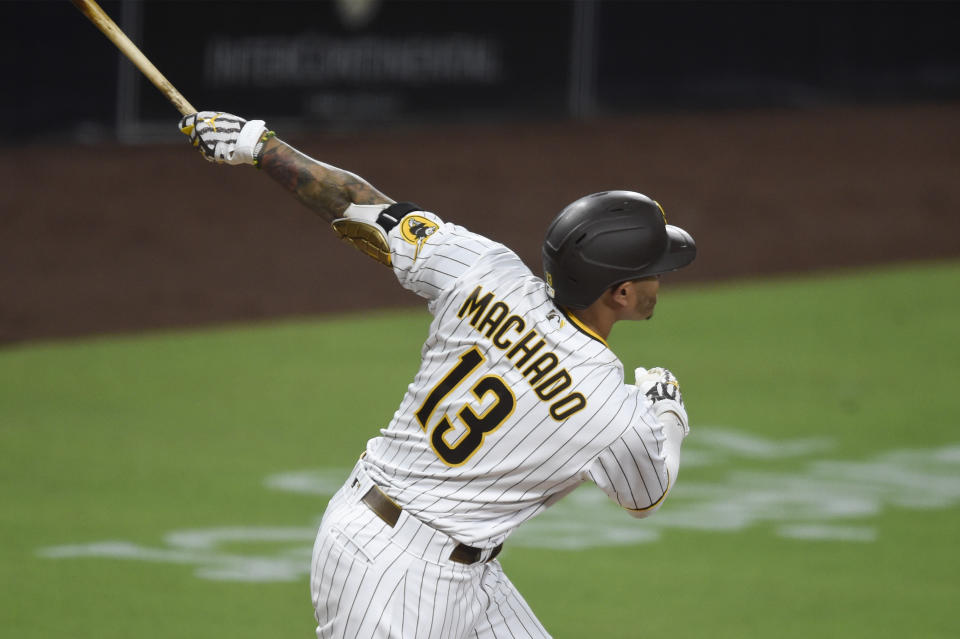 San Diego Padres' Manny Machado hits a two-run home run during the fourth inning of a baseball game against the Seattle Mariners, Friday, Sept. 18, 2020, in San Diego. (AP Photo/Denis Poroy)