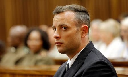 FILE PHOTO: Former Paralympian Oscar Pistorius appears for sentencing for the murder of Reeva Steenkamp at the Pretoria High Court, South Africa June 14, 2016. REUTERS/Kim Ludbrook/Pool/File Photo