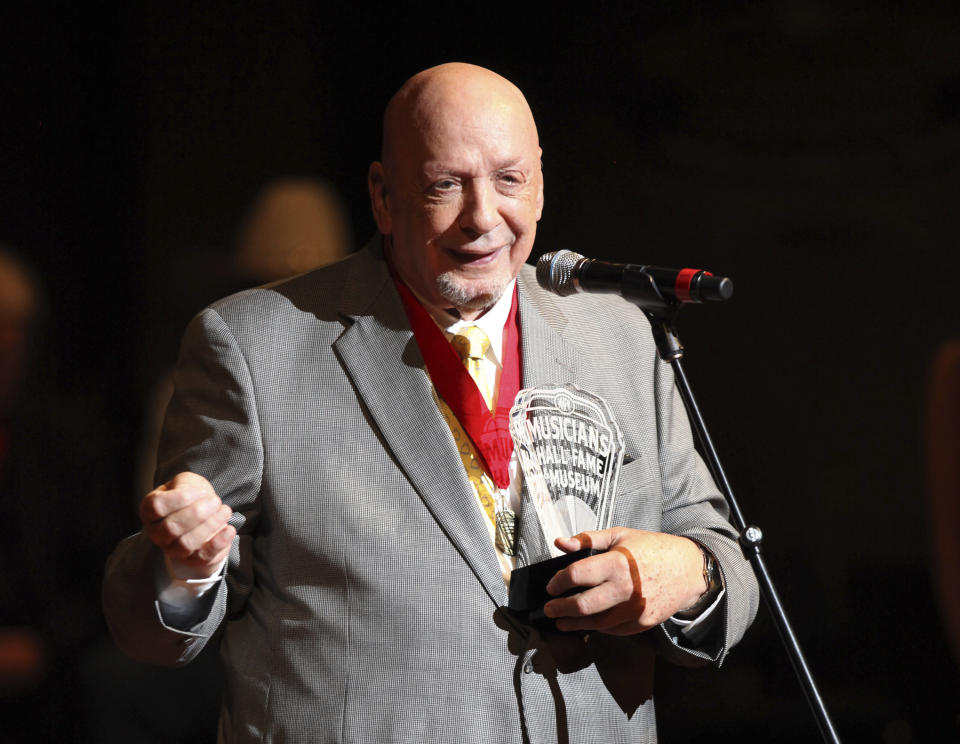 FILE - In this Oct. 12, 2009 file photo, Fred Foster speaks as he is inducted into the Musicians Hall of Fame at the Musicians Hall of Fame awards show in Nashville, Tenn. Foster, who produced some of Roy Orbison’s most iconic records and was the first to produce records from Kris Kristofferson and Dolly Parton, has died at the age of 87. His publicist, Martha Moore, said Foster died Wednesday, Feb. 20, 2019 in Nashville. (AP Photo/Josh Anderson, File)