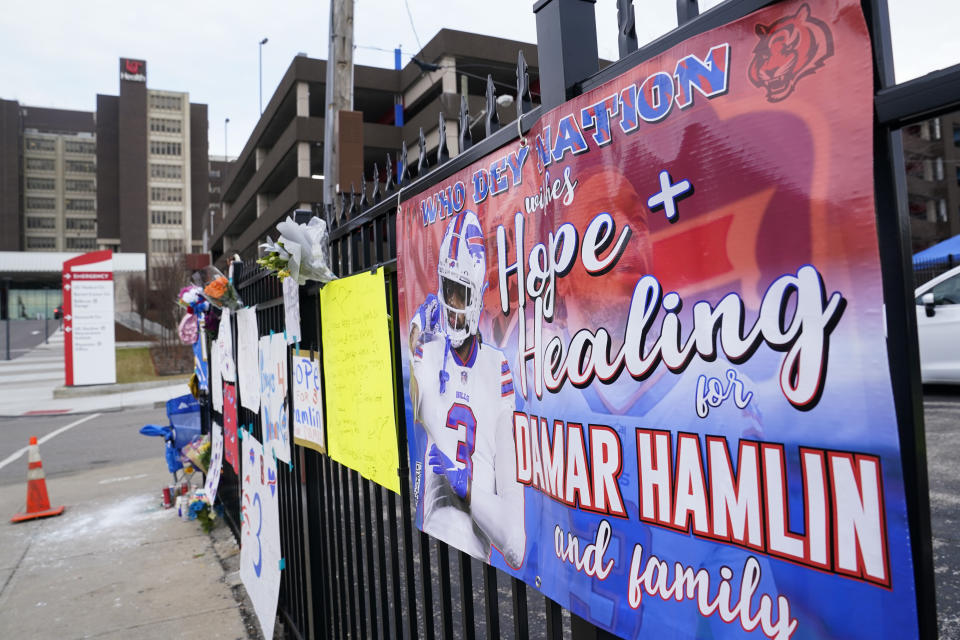 A sign sits along a fence outside UC Medical Center where Buffalo Bills safety Damar Hamiln remains hospitalized, Thursday, Jan. 5, 2023, in Cincinnati. Damar Hamlin has shown what physicians treating him are calling “remarkable improvement over the past 24 hours,” the team announced in a statement on Thursday, three days after the player went into cardiac arrest and had to be resuscitated on the field. (AP Photo/Joshua A. Bickel)