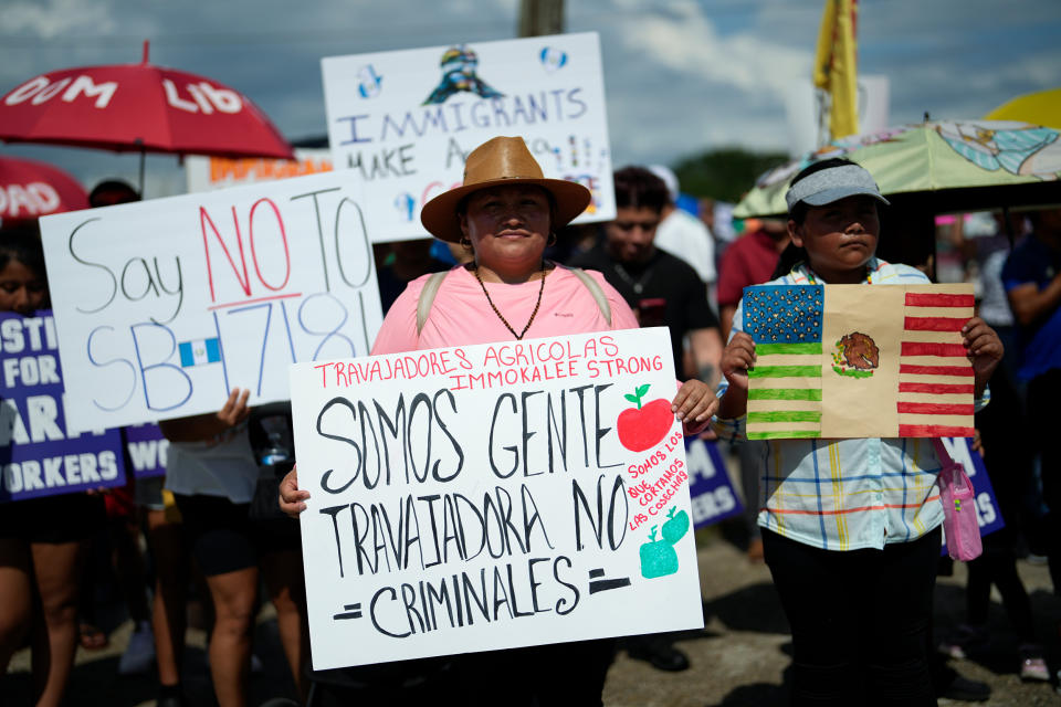 A woman carried a sign that reads: 