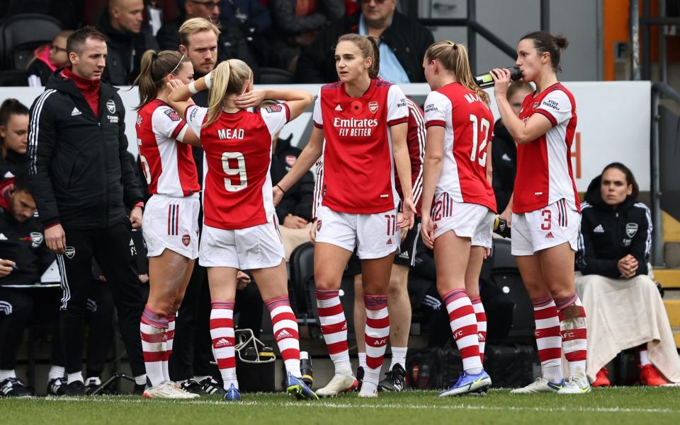 Arsenal boss Jonas Eidevall speaks to his players on the sidelines - GETTY IMAGES