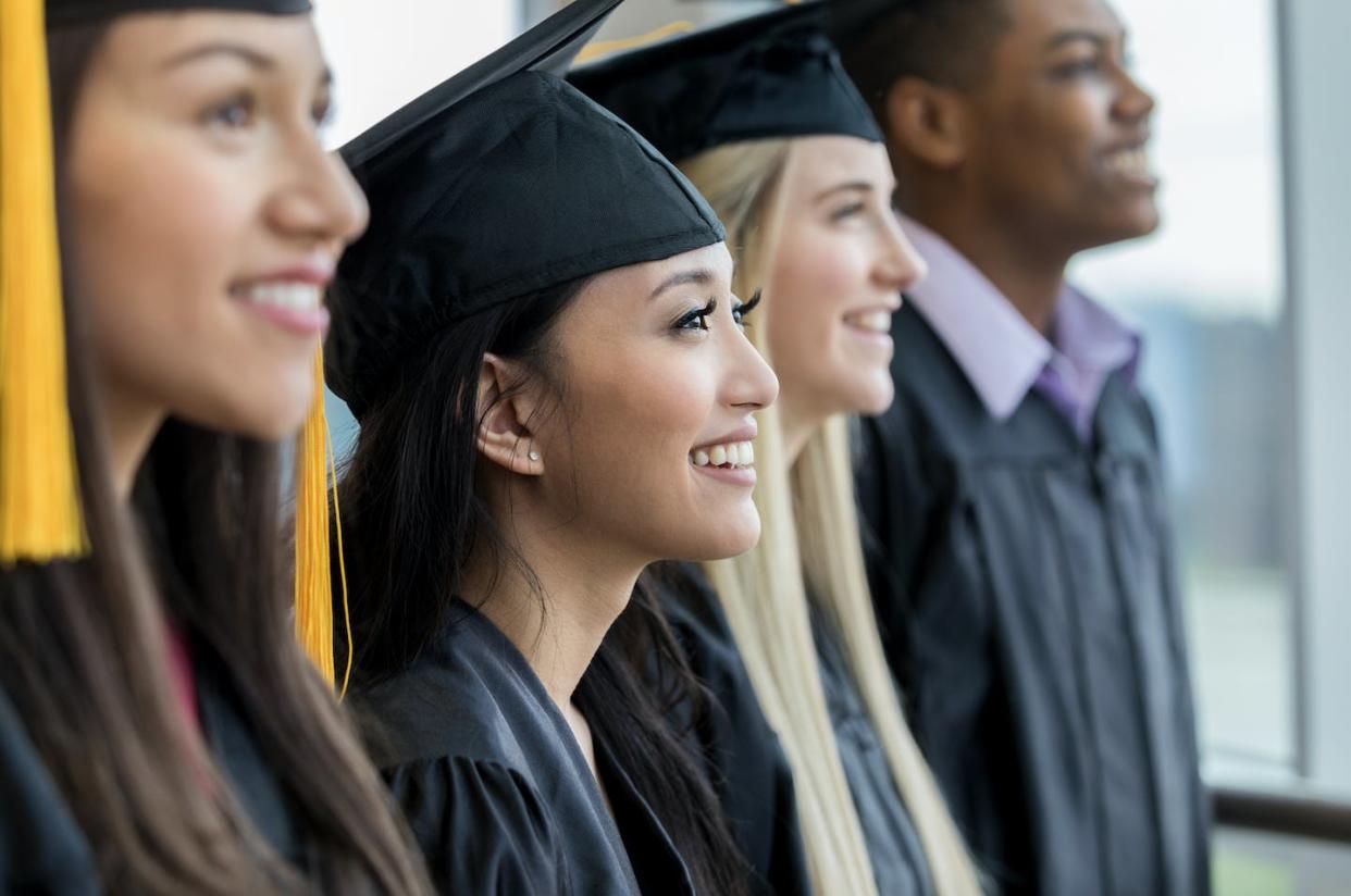 Nearly half of all full-time college students also work. <a href="https://www.gettyimages.com/detail/photo/high-school-graduates-in-a-row-royalty-free-image/1140162133?phrase=college%20student%20graduation&adppopup=true" rel="nofollow noopener" target="_blank" data-ylk="slk:SDI Productions via Getty Images;elm:context_link;itc:0;sec:content-canvas" class="link ">SDI Productions via Getty Images</a>