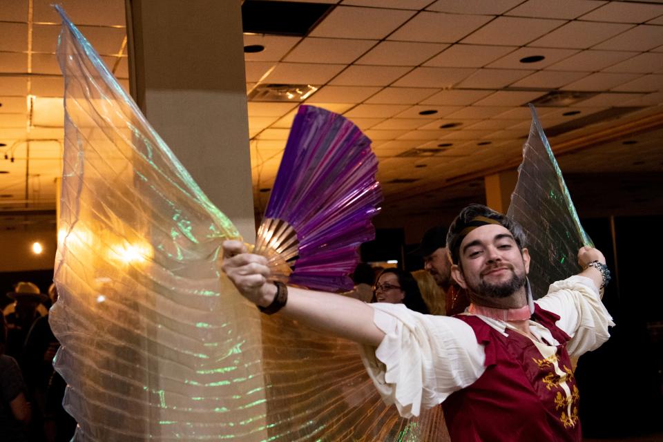 Jeremy Bratcher spreads the wings of his outfit during Jackson Pride Fest in the Carl Perkins Civic Center on Saturday, October 8, 2022, in Jackson, Tenn. “This is 2022, there’s too much hate,” Bratcher said. “People love to hate and hate to love and this event is all about love,” on why he wanted to come to the fest. 