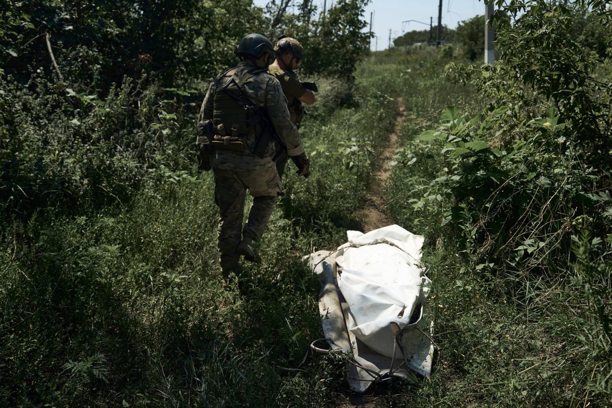 Ukrainian soldiers walk on the frontline near Bakhmut, Donetsk region (AP)