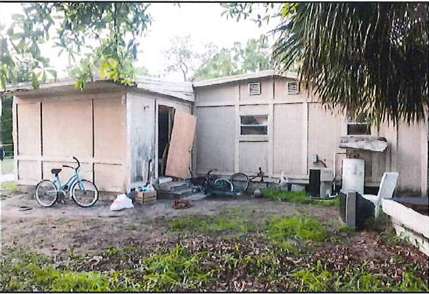 Indian River County Sheriff’s officials collect evidence around a known drug house off 45th Street, between 34th and 36th Avenue, in Gifford on Sunday, March 19, 2017. Deputies were attempting to enforce a search warrant that morning when shots were fired from inside the house. Alteria Woods, 21, was killed in the exchange of gunfire. Andrew Coffee IV, 26, faces six charges, including second-degree felony murder with a firearm and three counts of attempted first-degree murder of a law enforcement officer.