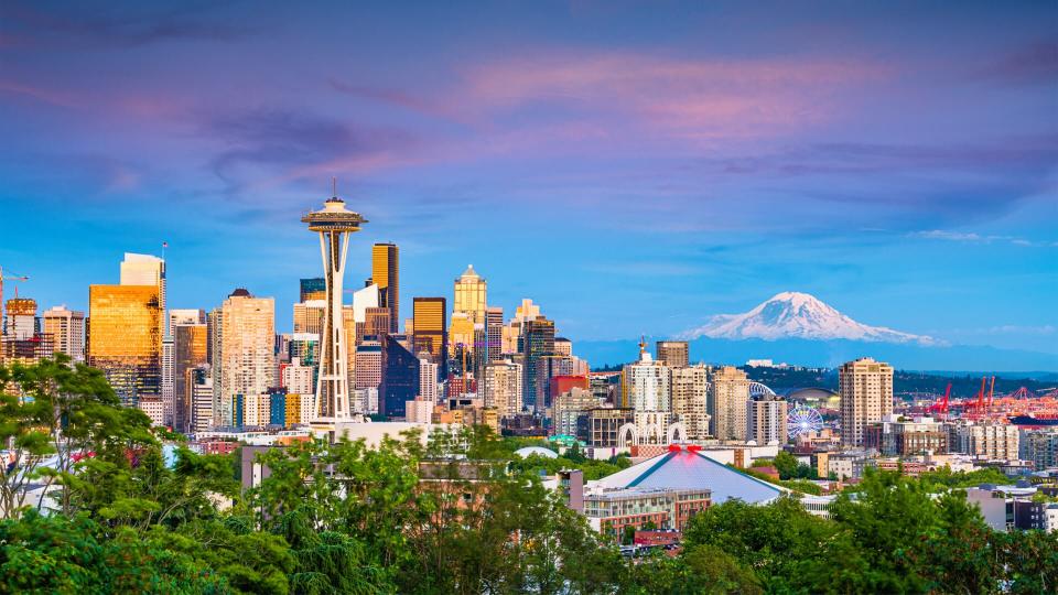 Seattle, Washington, USA downtown skyline at night with Mt.