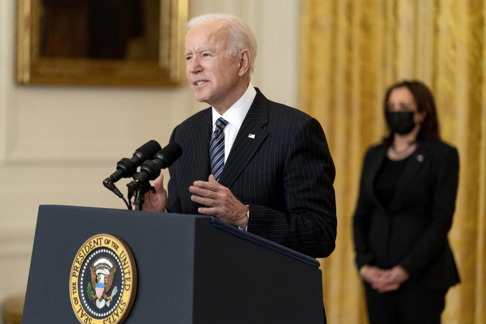 President Joe Biden, accompanied by Vice President Kamala Harris, right, speaks about COVID-19 vaccinations in the East Room of the White House, Thursday, March 18, 2021, in Washington. (AP Photo/Andrew Harnik)