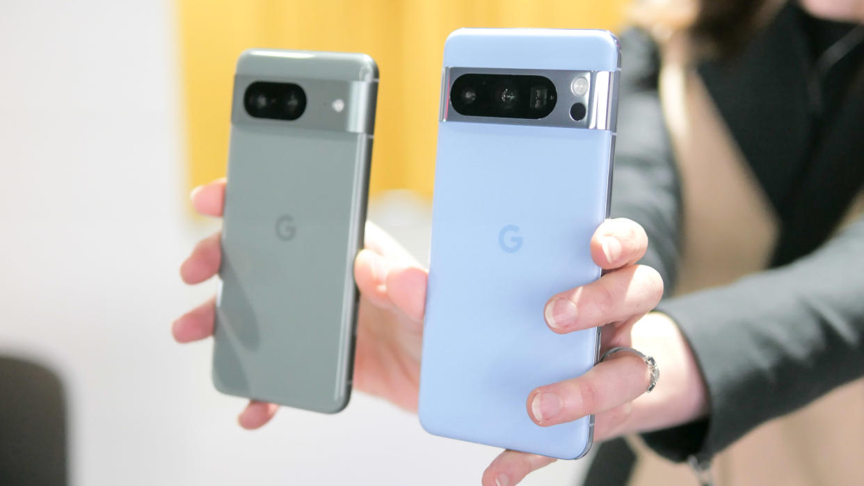  Google Pixel 8 and Pixel 8 Pro held in the hand. 