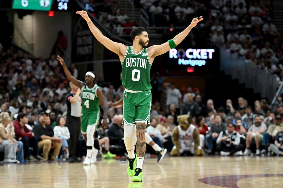 CLEVELAND, OHIO - MAY 13: Jayson Tatum #0 of the Boston Celtics and Jrue Holiday #4 of the Boston Celtics celebrate during the fourth quarter in Game Four of the Eastern Conference Second Round Playoffs at Rocket Mortgage Fieldhouse on May 13, 2024 in Cleveland, Ohio. NOTE TO USER: User expressly acknowledges and agrees that, by downloading and or using this photograph, User is consenting to the terms and conditions of the Getty Images License Agreement. (Photo by Nick Cammett/Getty Images)