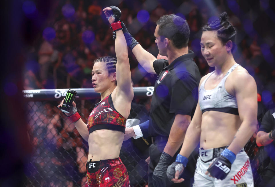 UFC women's strawweight champion Zhang Weili is announced as the winner over Yan Xiaonan in a women's title fight during the UFC 300 mixed martial arts event Saturday, April 13, 2024, in Las Vegas. Zhang retained her title by unanimous decision. (Steve Marcus/Las Vegas Sun via AP)