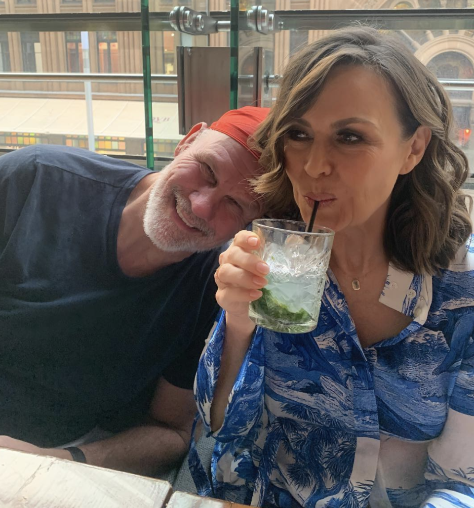 Lisa Wilkinson and Peter FitzSimons sitting next to one another at a restaurant