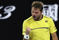 Switzerland's Stan Wawrinka celebrates a point win against Canada's Milos Raonic during their second round match at the Australian Open tennis championships in Melbourne, Australia, Thursday, Jan. 17, 2019. (AP Photo/Aaron Favila)