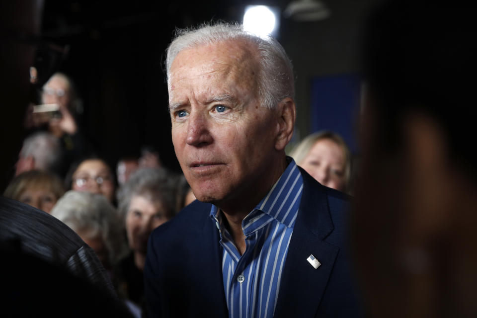 In this May 1, 2019, photo, former Vice President and Democratic presidential candidate Joe Biden greets audience members during a rally in Iowa City, Iowa. Biden’s candidacy didn’t scare off any of his rivals, who lined up one after another in a race they believed was truly up for grabs. Did they underestimate him? Biden’s political liabilities are many, but he’s quickly emerged as an overwhelming front-runner who’s dominating the race for money and political oxygen in the crowded 2020 Democratic contest. (AP Photo/Charlie Neibergall)