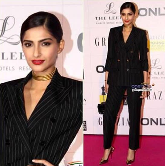 Her androgynous look was teamed with a red pout and a chic chignon.Image:Instagram.com/Sonamkapoor