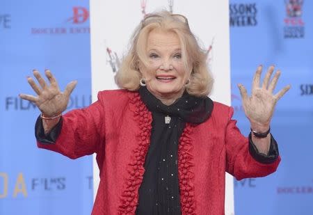 Gena Rowlands poses for photographers at a ceremony where the actress places hand and footprints in the forecourt of the TCL Chinese Theatre in Los Angeles December 5, 2014. REUTERS/Phil McCarten/Files