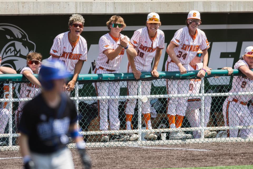 Players in Skyridge’s dugout cheer after a strike during a 6A baseball state tournament game at UCCU Ballpark in Orem on Monday, May 22, 2023. | Ryan Sun, Deseret News