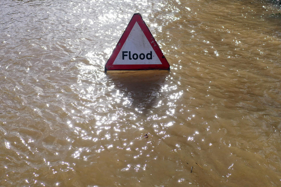 WORCESTER, ENGLAND - FEBRUARY 27:  A warning sign is surrounded by water as floodwaters persist in the centre of Worcester City after the River Severn burst its banks on February 27, 2020 in Worcester, England. Flooding levels are decreasing after storms Ciara and Dennis, however forecasters are predicting more rain and 70mph winds this weekend from storm Jorge. (Photo by Christopher Furlong/Getty Images)