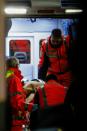 Emergency personnel arrive with the three children rescued from the avalanche that engulfed the Hotel Rigopiano, at the Pescara Central hospital on January 20, 2017