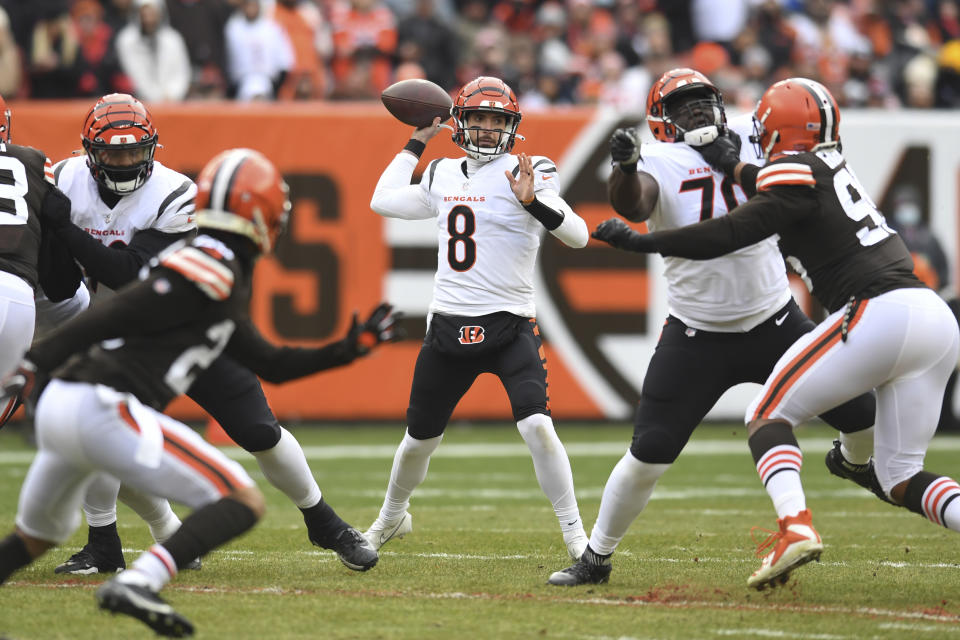 Cincinnati Bengals quarterback Brandon Allen (8) throws during the first half of an NFL football game against the Cleveland Browns, Sunday, Jan. 9, 2022, in Cleveland. (AP Photo/Nick Cammett)