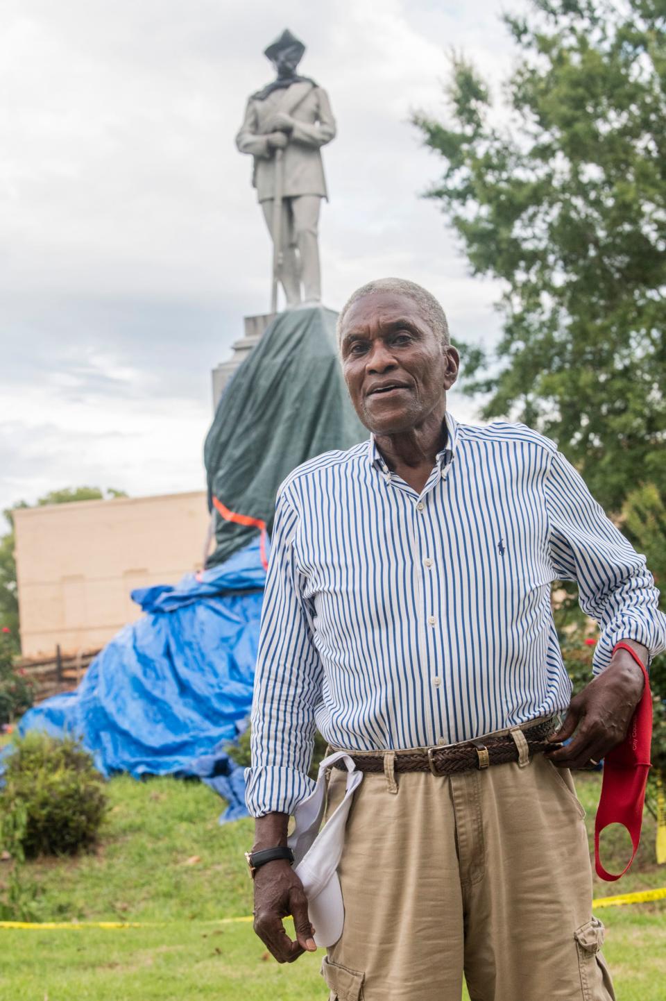 Former Mayor Johnny Ford stands in front of the Confederate monument he attempted to take down today before he was stopped by the sheriff in the town square in Tuskegee this past July.