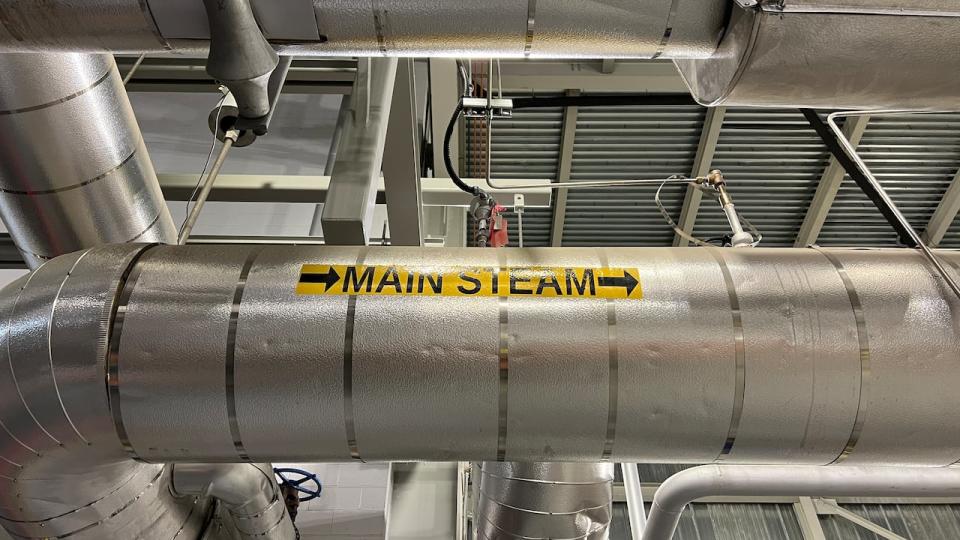 Steam produced by burning garbage at high temperatures travels through pipes to turbines, where it produces electricity. The Durham York Energy Centre produces enough energy to power 10,000 homes per year. 