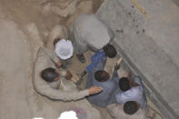 Egyptian excavation workers labor outside the site of the newly discovered giant black sarcophagus in Sidi Gaber district of Alexandria, Egypt July 19, 2018 in this handout picture courtesy of the Ministry of Antiquities. The Ministry of Antiquities/Handout via Reuters