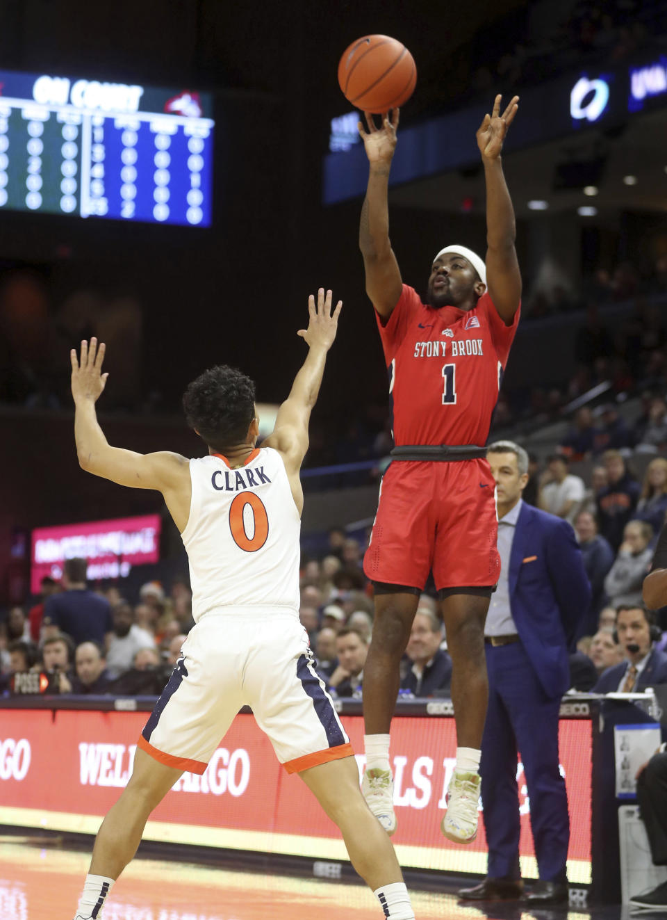 Stony Brook guard Makale Foreman (1) shoots over Virginia guard Kihei Clark (0) during an NCAA college basketball game in Charlottesville, Va., Wednesday, Dec. 18, 2019. (AP Photo/Andrew Shurtleff)