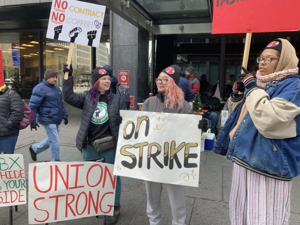 Workers picket outside the Starbucks coffee shop at 3rd and Broad streets Downtown on Thursday.