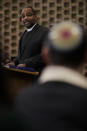 In this Jan. 17, 2020, photo Rev. Dr. Maurice Charles, dean of Rockefeller Memorial Chapel, speaks during the Friday Shabbat Service at KAM Isaiah Israel in Chicago. On the eve of the day set aside to honor an African American who strove against hate and preached racial and social justice, some worry the nation is becoming more divided. (AP Photo/Nam Y. Huh)