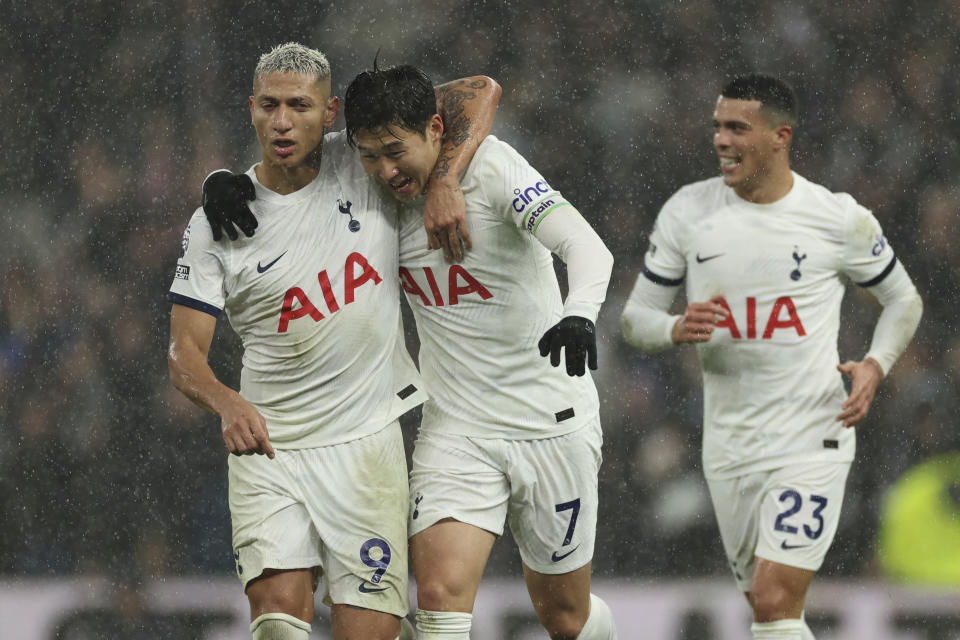 Tottenham's Son Heung-min, centre, celebrates after scoring his side's second goal during the English Premier League soccer match between Tottenham Hotspur and AFC Bournemouth at the Tottenham Hotspur Stadium in London, Sunday, Dec. 31, 2023. (AP Photo/Ian Walton)