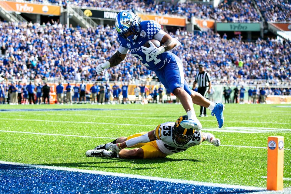 Citrus Bowl: Kentucky running back Chris Rodriguez Jr. rolls off a tackle from Iowa defensive back Riley Moss into the end zone

Syndication Hawkcentral