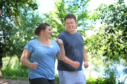 <span class="caption">Most of these initiatives still place emphasis on getting people to change their eating and lifestyle habits.</span> <span class="attribution"><a class="link " href="https://www.shutterstock.com/image-photo/overweight-couple-running-green-park-746805604" rel="nofollow noopener" target="_blank" data-ylk="slk:Africa Studio/ Shutterstock;elm:context_link;itc:0;sec:content-canvas">Africa Studio/ Shutterstock</a></span>